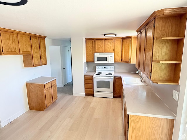 3841 W Bluebird Cir, West Valley City, UT 84120 - kitchen featuring white appliances, open shelves, brown cabinets, light wood-type flooring, and light countertops