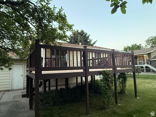 3841 W Bluebird Cir, West Valley City, UT 84120 - back of property featuring a deck and a yard