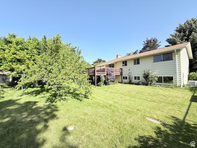 3841 W Bluebird Cir, West Valley City, UT 84120 - view of green lawn featuring a deck