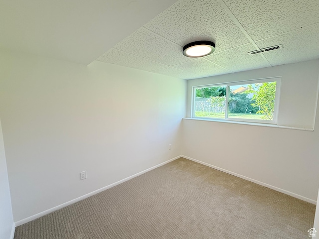 3841 W Bluebird Cir, West Valley City, UT 84120 - carpeted empty room with a drop ceiling and baseboards
