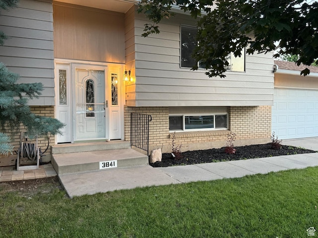 3841 W Bluebird Cir, West Valley City, UT 84120 - entrance to property with brick siding and a garage