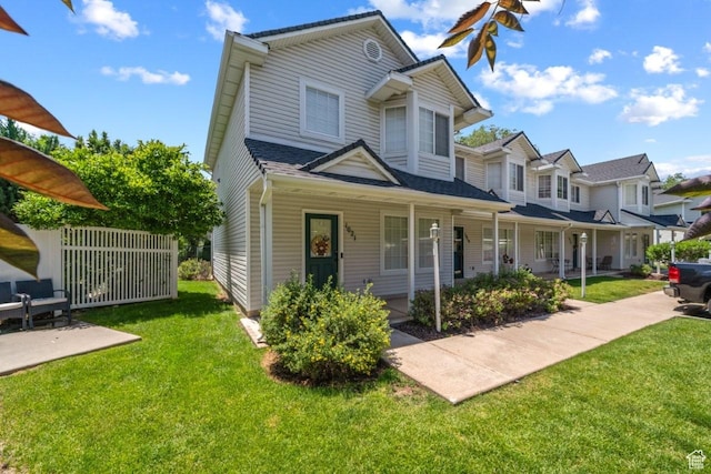 1021 Sara Ln, Ogden, UT 84404 - view of front of home featuring a front yard and covered porch
