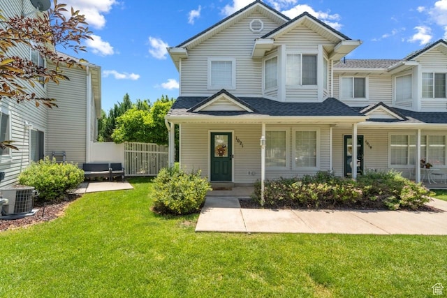 1021 Sara Ln, Ogden, UT 84404 - view of front of home featuring a shingled roof and covered porch