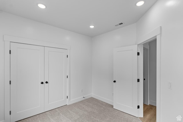 233 E 580 N, Providence, UT 84332 - unfurnished bedroom featuring recessed lighting, a closet, and light carpet