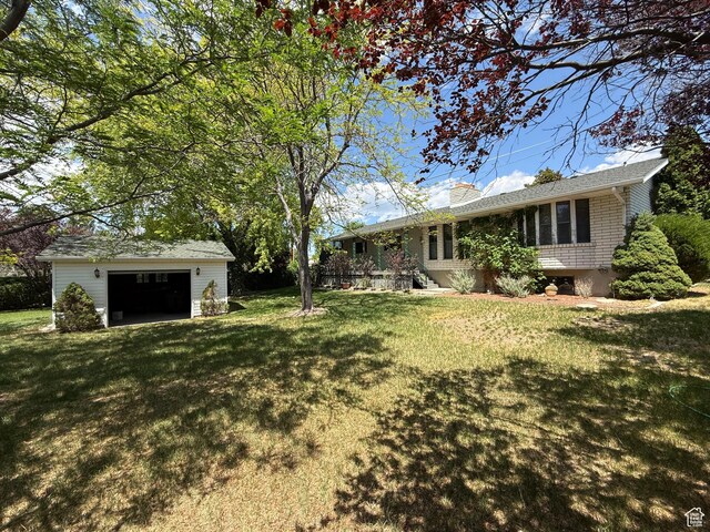 1177 W 2060 N, Helper, UT 84526 - view of green lawn with an outbuilding and a garage