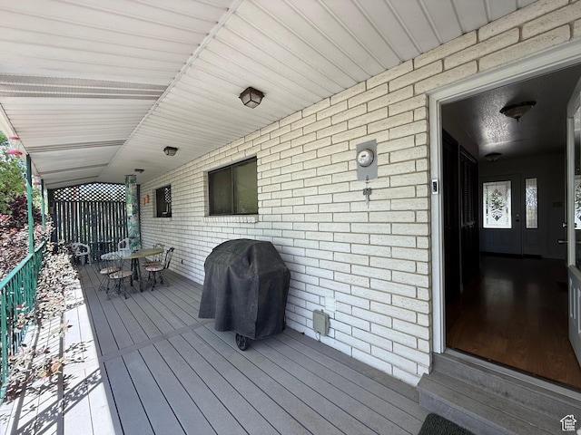 1177 W 2060 N, Helper, UT 84526 - wooden terrace featuring outdoor dining space and a grill