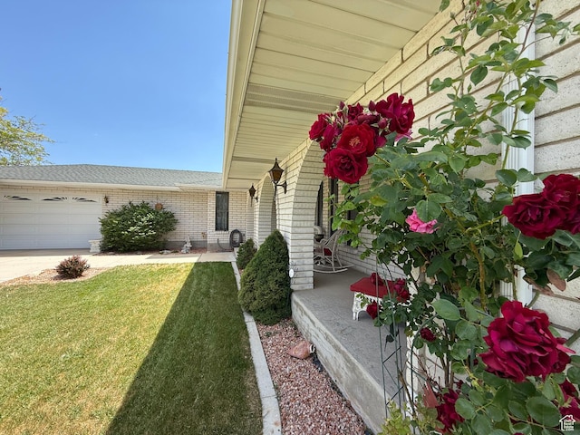 1177 W 2060 N, Helper, UT 84526 - doorway to property with brick siding, a lawn, an attached garage, and driveway