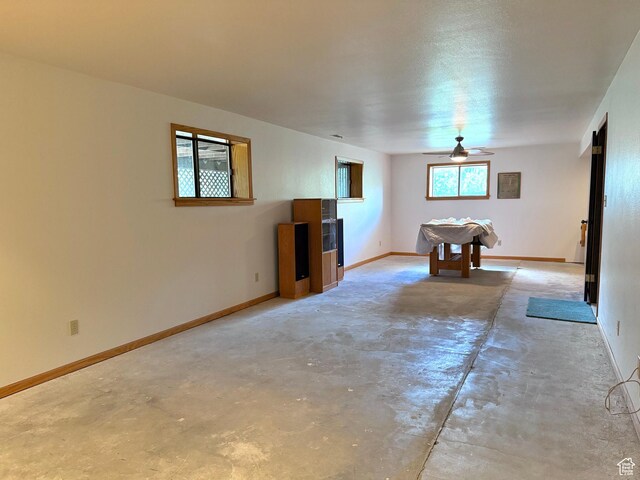 1177 W 2060 N, Helper, UT 84526 - unfurnished living room with unfinished concrete flooring and ceiling fan