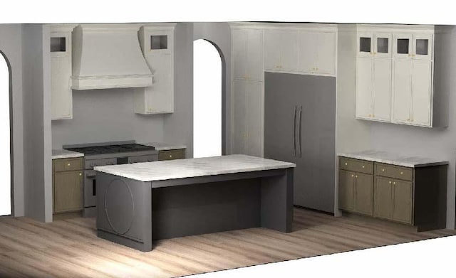 1053 N 930 E Unit 73, American Fork, UT 84003 - kitchen featuring custom exhaust hood, light wood-style floors, and arched walkways