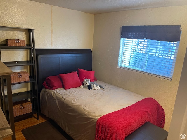1086 W Wenco Dr S, Salt Lake City, UT 84104 - bedroom with a textured wall and wood finished floors