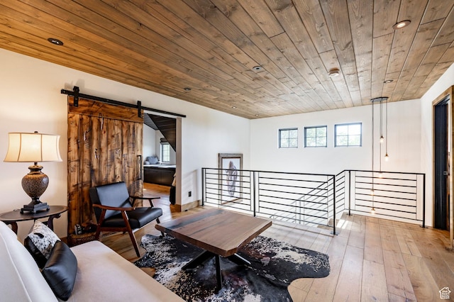 1766 W Arapaho Dr, Wanship, UT 84017 - living area with an upstairs landing, wood ceiling, hardwood / wood-style flooring, a barn door, and recessed lighting