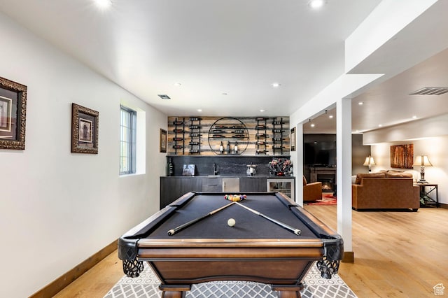 1766 W Arapaho Dr, Wanship, UT 84017 - recreation room featuring a dry bar, wood finished floors, billiards table, recessed lighting, and a warm lit fireplace
