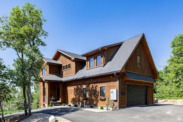 1766 W Arapaho Dr, Wanship, UT 84017 - log home featuring an attached garage, asphalt driveway, and covered porch
