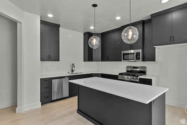 216 E 610 N, Providence, UT 84332 - kitchen with stainless steel appliances, dark cabinets, light countertops, hanging light fixtures, and recessed lighting