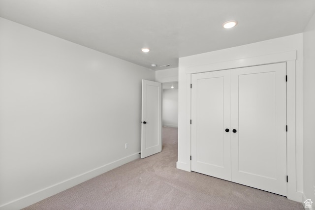 216 E 610 N, Providence, UT 84332 - unfurnished bedroom featuring light carpet, recessed lighting, and a closet