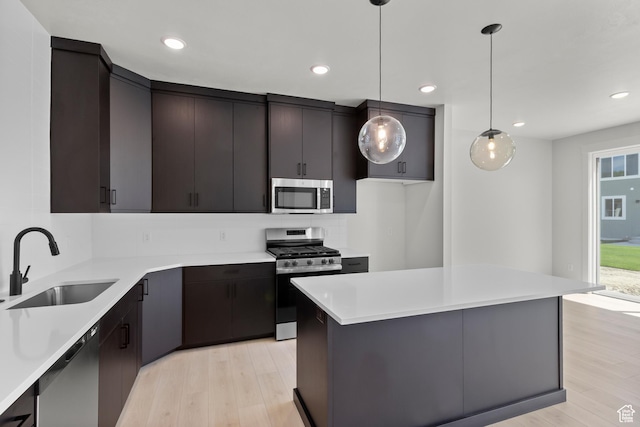216 E 610 N, Providence, UT 84332 - kitchen featuring stainless steel appliances, light wood-style flooring, light countertops, decorative light fixtures, and recessed lighting