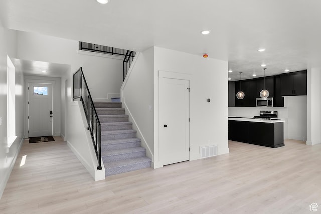 216 E 610 N, Providence, UT 84332 - entrance foyer with recessed lighting, stairs, and light wood finished floors