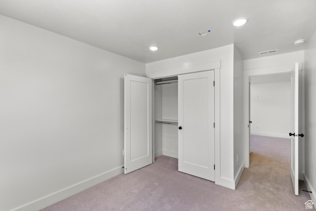 216 E 610 N, Providence, UT 84332 - unfurnished bedroom featuring light carpet, a closet, and recessed lighting