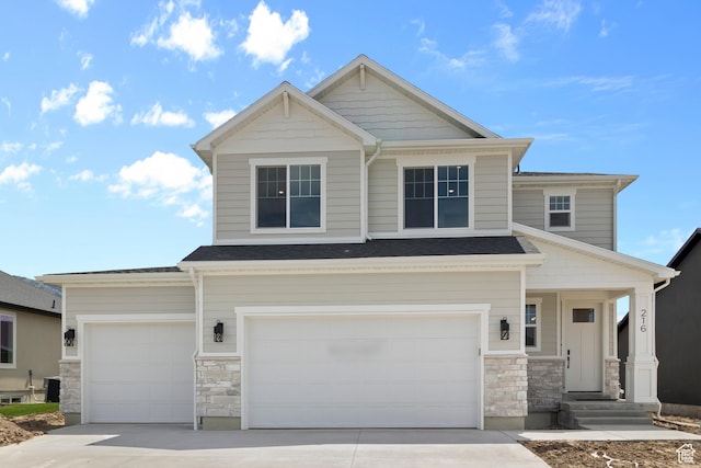216 E 610 N, Providence, UT 84332 - craftsman-style house featuring stone siding, concrete driveway, and a garage