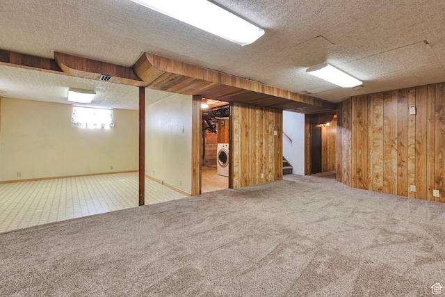 4683 W 3855 S, West Valley City, UT 84120 - below grade area featuring washer / dryer, wood walls, carpet floors, stairs, and a textured ceiling