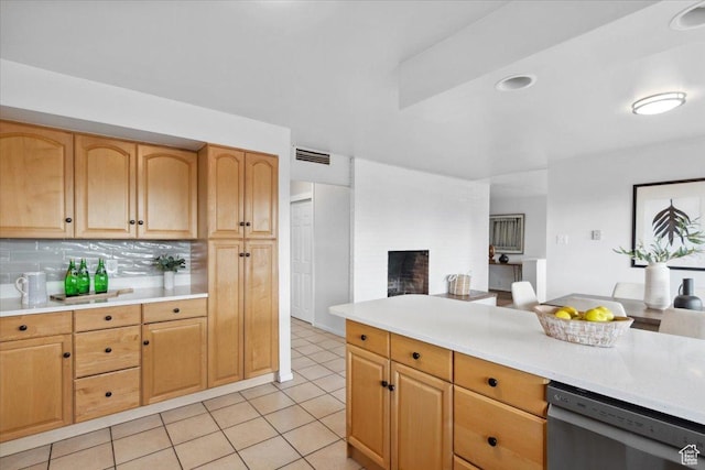 1881 S Foothill Dr E, Salt Lake City, UT 84108 - kitchen with dishwashing machine, light countertops, open floor plan, and a brick fireplace