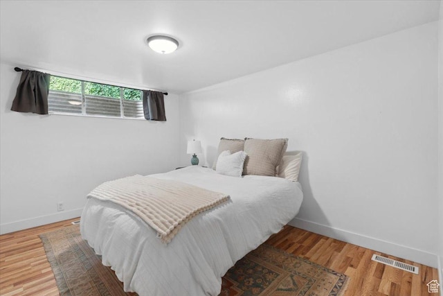 1881 S Foothill Dr E, Salt Lake City, UT 84108 - bedroom featuring baseboards and wood finished floors