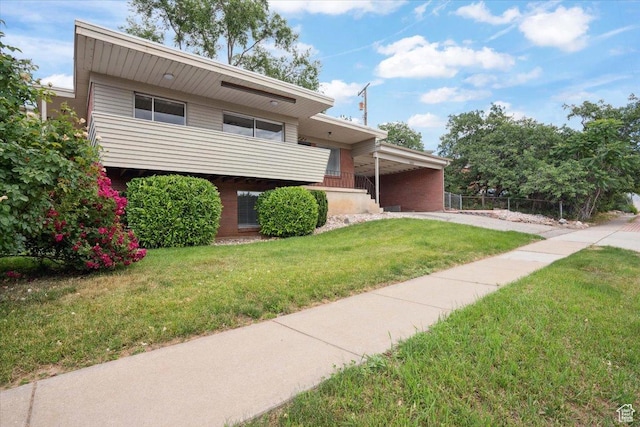 1881 S Foothill Dr E, Salt Lake City, UT 84108 - tri-level home featuring an attached carport and driveway
