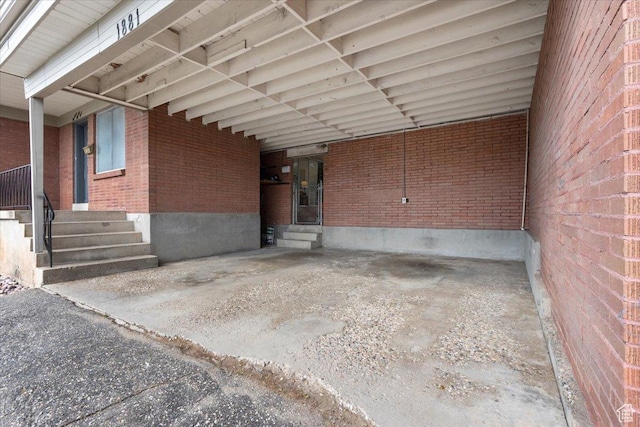 1881 S Foothill Dr E, Salt Lake City, UT 84108 - view of patio featuring entry steps and an attached carport