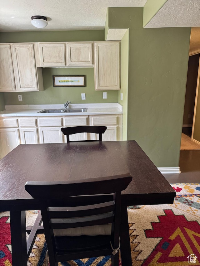 471 N 100 W, Kamas, UT 84036 - kitchen with a textured ceiling, white cabinetry, and light countertops