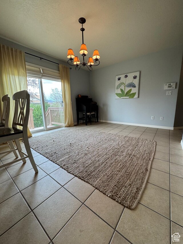 471 N 100 W, Kamas, UT 84036 - unfurnished dining area featuring tile patterned flooring, a chandelier, and a textured ceiling