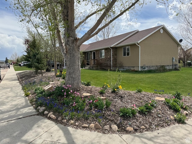 471 N 100 W, Kamas, UT 84036 - view of property exterior with stucco siding, a lawn, and a shingled roof