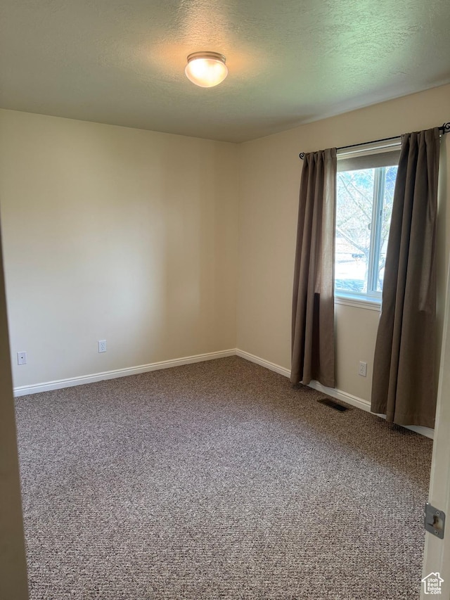 471 N 100 W, Kamas, UT 84036 - unfurnished room with carpet floors and a textured ceiling