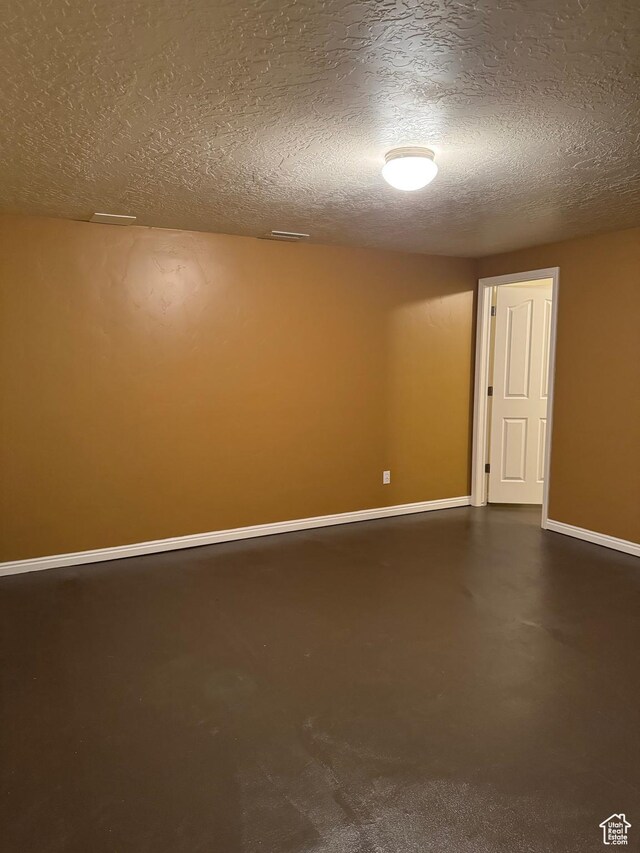 471 N 100 W, Kamas, UT 84036 - empty room featuring a textured ceiling and concrete flooring