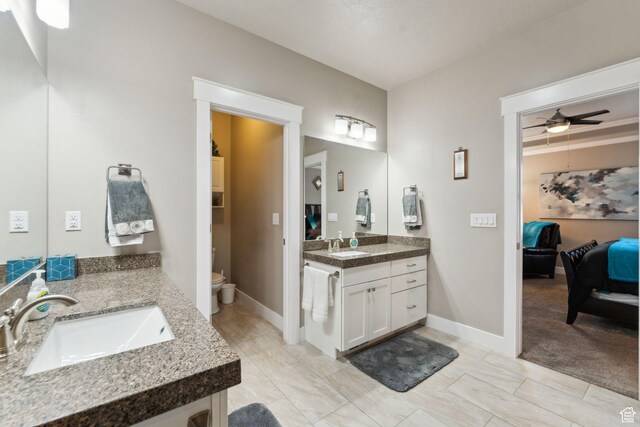 5673 S Wilson View Ct, Holladay, UT 84121 - full bathroom featuring ensuite bathroom, two vanities, and ceiling fan