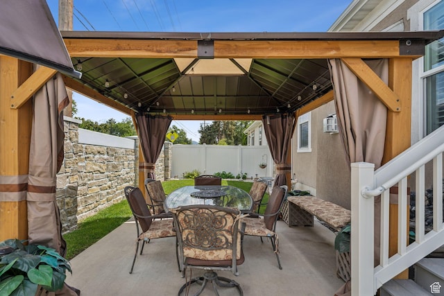 5673 S Wilson View Ct, Holladay, UT 84121 - view of patio with outdoor dining area, a gazebo, and an AC wall unit