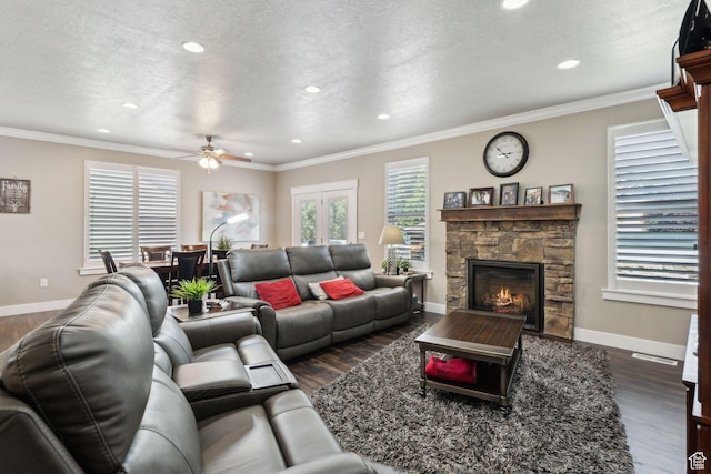 5673 S Wilson View Ct, Holladay, UT 84121 - living area with dark wood-style flooring, recessed lighting, a stone fireplace, ceiling fan, and a textured ceiling