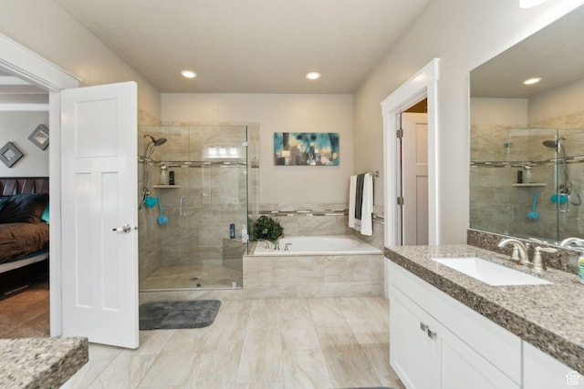 5673 S Wilson View Ct, Holladay, UT 84121 - full bath with a garden tub, a stall shower, vanity, ensuite bathroom, and recessed lighting