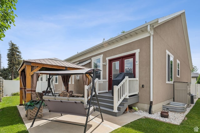 5673 S Wilson View Ct, Holladay, UT 84121 - back of house with a gazebo, a patio, and stucco siding