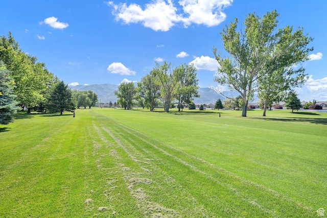 97 Hillsborough Dr, Pleasant View, UT 84414 - view of community with a mountain view, a yard, and view of golf course