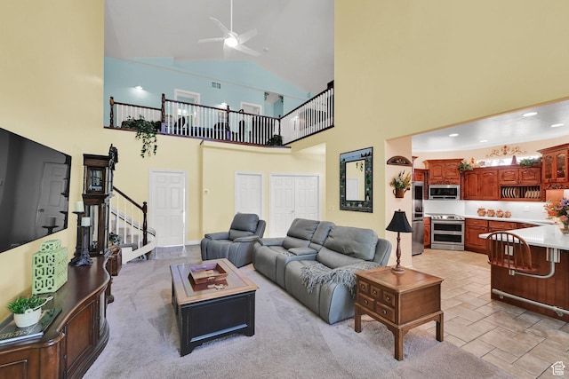 97 Hillsborough Dr, Pleasant View, UT 84414 - living area featuring stairway, ceiling fan, and high vaulted ceiling