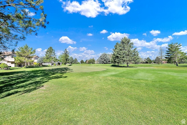97 Hillsborough Dr, Pleasant View, UT 84414 - surrounding community with a lawn and golf course view