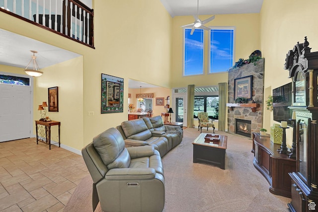97 Hillsborough Dr, Pleasant View, UT 84414 - living room with a towering ceiling, a fireplace, ceiling fan, and stone tile floors