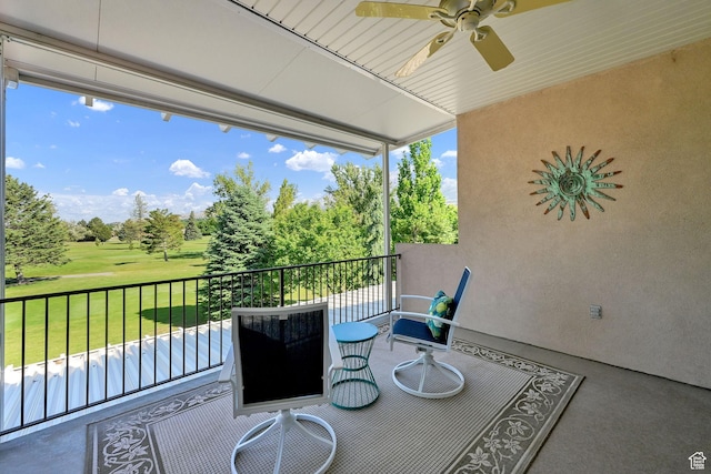 97 Hillsborough Dr, Pleasant View, UT 84414 - patio / terrace featuring a ceiling fan, view of golf course, view of wooded area, and a yard