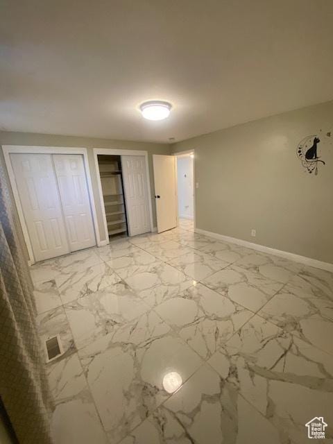 314 W Center St N Unit 135, Bountiful, UT 84010 - unfurnished bedroom featuring two closets and light marble finish flooring