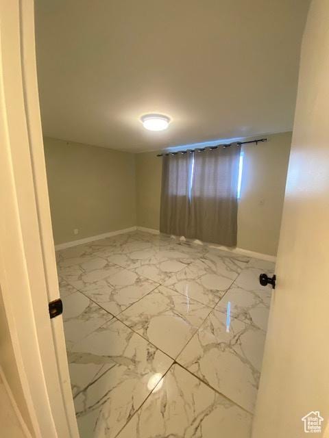 314 W Center St N Unit 135, Bountiful, UT 84010 - empty room with baseboards and marble look tiles