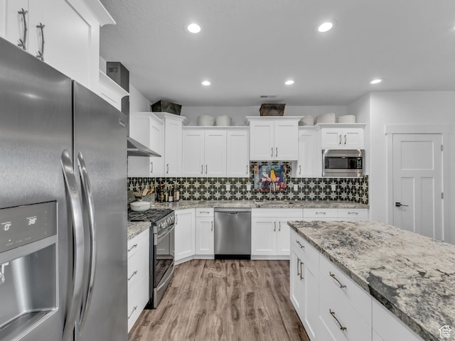 354 E 370 S, Kamas, UT 84036 - kitchen with appliances with stainless steel finishes, white cabinets, light wood-style floors, and recessed lighting