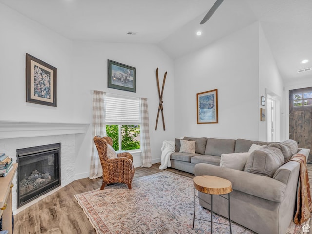 354 E 370 S, Kamas, UT 84036 - living room with lofted ceiling, a ceiling fan, a glass covered fireplace, wood finished floors, and recessed lighting