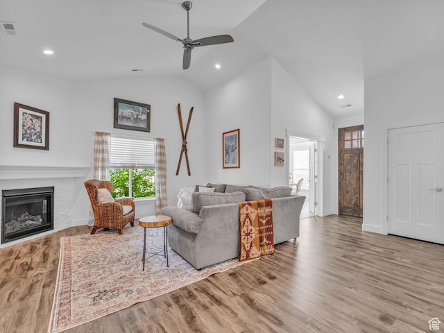 354 E 370 S, Kamas, UT 84036 - living room with vaulted ceiling, a ceiling fan, a fireplace, wood finished floors, and recessed lighting