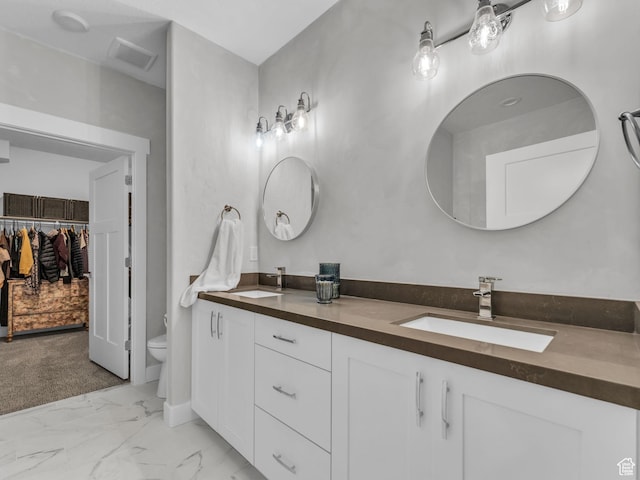354 E 370 S, Kamas, UT 84036 - bathroom with double vanity, marble look tile flooring, and a walk in closet
