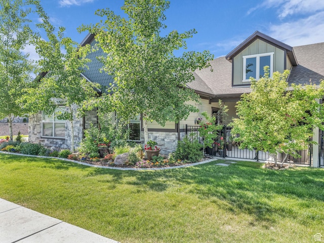 354 E 370 S, Kamas, UT 84036 - view of front of house featuring stone siding, a front yard, and a shingled roof